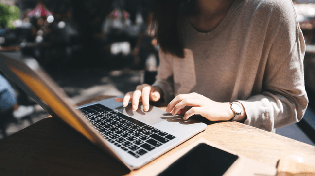 Woman checking her bank account on her laptop